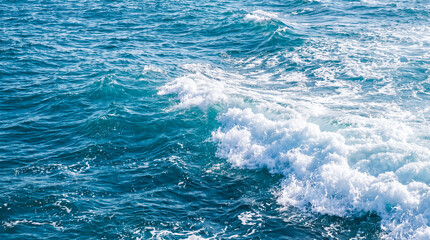 Fototapeta premium Powerful Ocean Wave Crashing with White Foam — Turquoise Blue Sea Water Texture Background