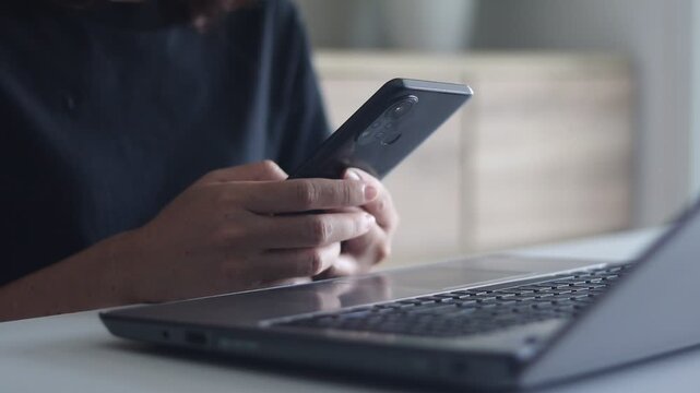 A woman using and sliding touch on mobile phone screen, close up hands scrolling gadget addicted female girl user influencer holding sliding with fingers using smartphone internet.