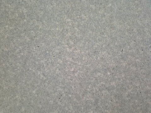 Close up of grey recycled cardboard fiberboard texture background