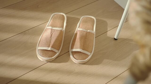 Home slippers on a wooden floor