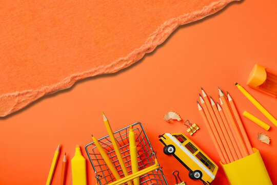 Back to school, Colorful assortment of school supplies arranged on vibrant background