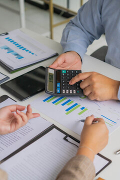 Asian business people calculate financial company