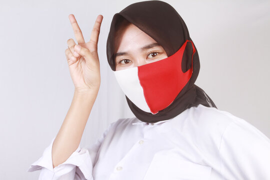 portrait of a young woman wearing a mask