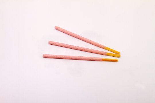 pink stick on white table