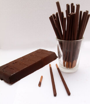 chocolate bar with chocolate stick on table
