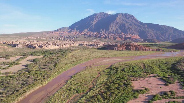 4K drone aerial view of Las Ventanas in Cafayate, Salta, Argentina. Unique red rock formations with natural openings shaped by erosion in the dramatic Quebrada de las Conchas landscape.