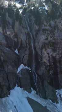 Bernese Highlands Simmen Falls waterfall in Lenk im Simmental, Switzerland vertical video