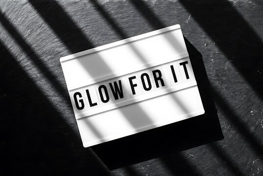 Illuminated message box with 'GLOW FOR IT' text, offering inspiration and motivation.