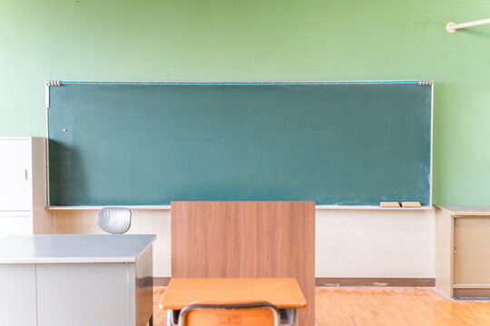Image of a classroom/school building with a blackboard.