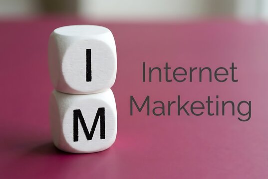 Stacked dice showing 'IM' with text 'Internet Marketing' on a purple surface. Digital Strategy and E-commerce concept