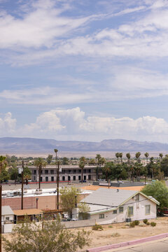 Afternoon hot summer view of buildings and surroudning mountains of Needles, California, USA.