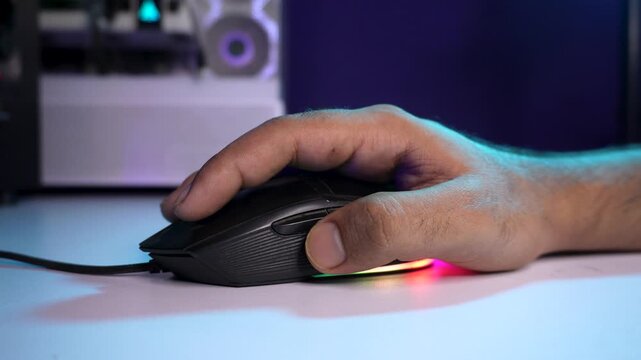 Close Up of Hand Using Wired Computer Mouse in Modern Workspace