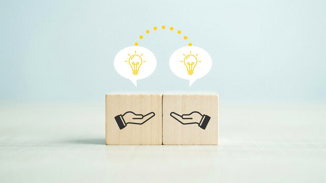 Wooden blocks representing knowledge transfer and sharing creative ideas for business collaboration