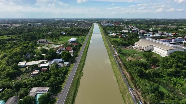 Irrigation canal alongside a graded service road, illustrating water management infrastructure and regional resource distribution systems.
