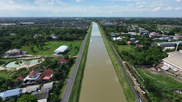 Irrigation canal alongside a graded service road, illustrating water management infrastructure and regional resource distribution systems.