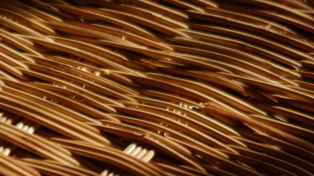 Woven Rattan Wicker Texture with Warm Sunlight, Close-Up Natural Basket Weave Pattern