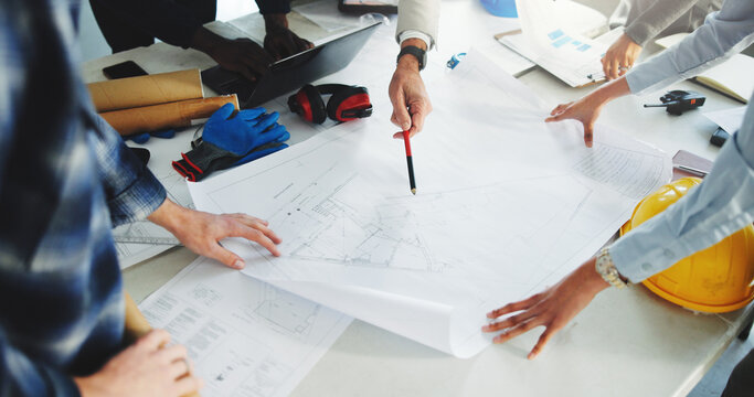 Architect, team and hands in office with blueprint, brainstorming and technical drawing of building. People, meeting and floor plan in workplace for construction guide, layout design or architecture.