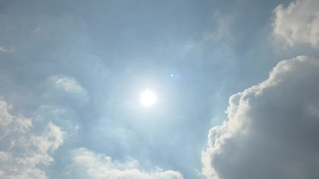 Bright Sun Shining Through Dramatic Clouds with Silver Lining