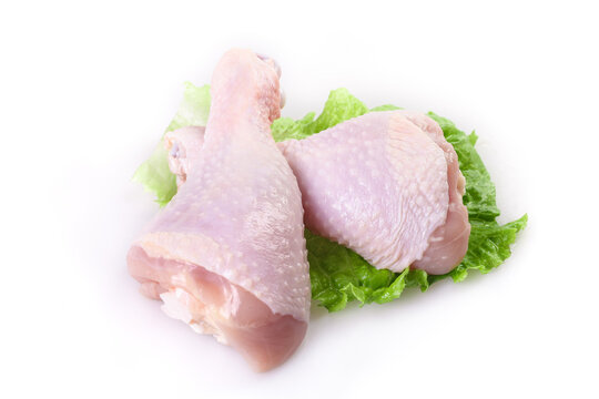 Fresh Raw Chicken Legs and Thighs on Lettuce for Supermarket Display