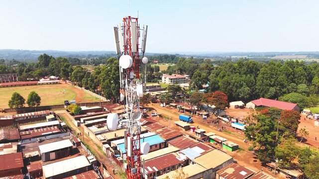 Communication mask, telecommunication Aerial wide shot of showing modern skyline of Rural kenya settlement with old architectures in background and poor ghetto suburb district of Kibera.