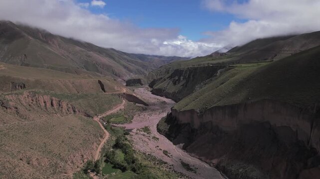 4K drone aerial view of Abra del C&oacute;ndor on the road to Iruya, Salta, Argentina. Spectacular Andean mountain pass with dramatic valleys, winding routes and breathtaking high altitude landscapes.