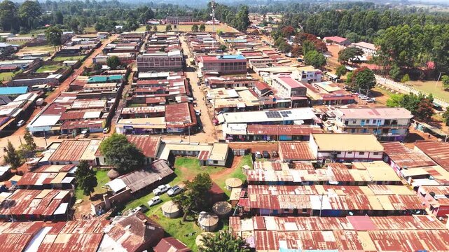 Communication mask, telecommunication Aerial wide shot of showing modern skyline of Rural kenya settlement with old architectures in background and poor ghetto suburb district of Kibera.