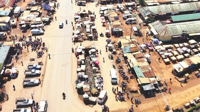 Aerial wide shot of showing modern skyline of Rural kenya settlement with old architectures in background and poor ghetto suburb district of Kibera in foreground.