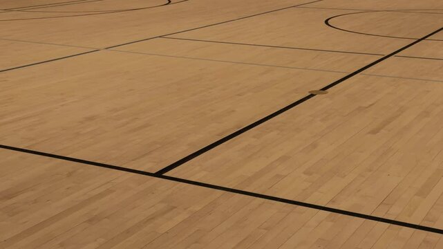 Slow diagonal pan moves from lower left to upper right across an empty court.