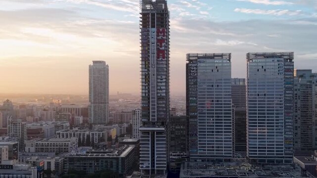 Cinematic Aerial Shot of the now Famous Graffiti Buildings in LA Reveals an eerie Sunrise view of Urban Decay in the Big City. Abandoned and Left for Rot due to a Failed Business Deal.