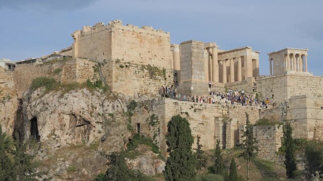 Tourists at the Propylaea and Temple of Athena Nike on the Acropolis in Athens Greece