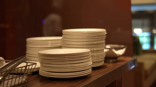 Stack of Clean White Ceramic Plates Ready for Buffet Service