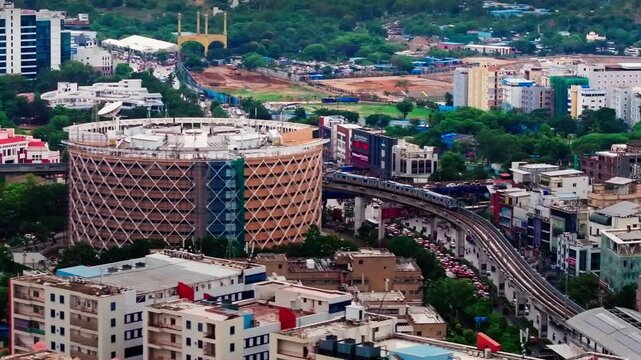iconic Cyber Towers building with metro rail, flyover, traffic flow and Hitex Charminar at hitec city, madhapur, hyderabad, telangana, india. day time, trucking shot, drone shot, 4k.