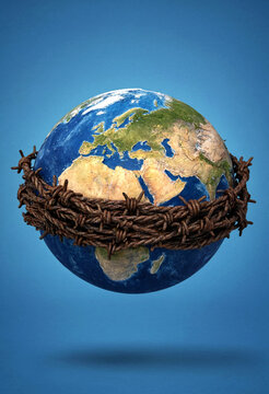 Conceptual image of earth wrapped in barbed wire showing environmental or social constraints
