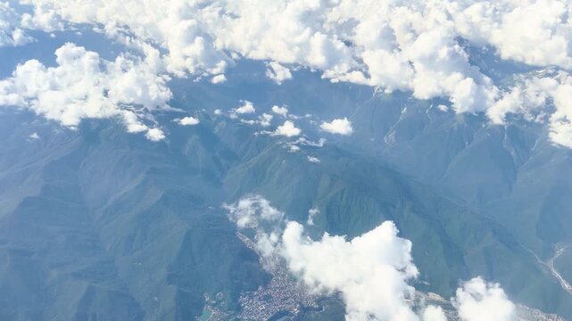 Aerial view mountain. Scenic aerial view from forest to mountain ridge. Above green landscape with sunlight mountains covered with clouds	