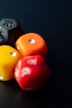 Macro shot of colorful gaming dice on a dark surface The Concept of board games and hobby