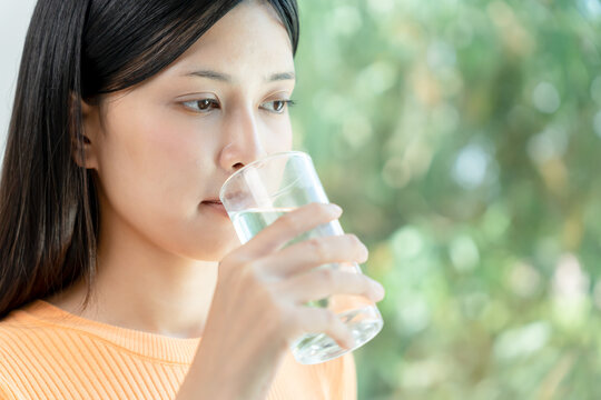 slim body asian women choose drink for good skin, dieting female choose water for diet. Good healthy food. weight lose, balance, control, reduce fat, low calories, routines, exercise, body shape.