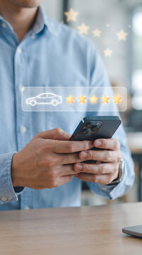 Individual using mobile phone to submit positive five star review for car dealership with glowing golden icons and white vehicle graphic for enhanced consumer digital engagement.
