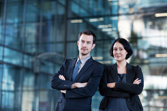 Business people, arms crossed and portrait in city for consultant, asset management or investor. Private equity associate, venture capitalist and corporate agency with man and woman in New York
