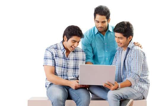 Three friends looking at computer