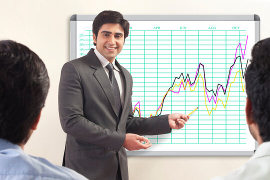 Businessman presenting to colleagues�