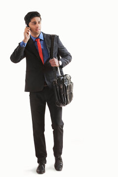 Young businessman talking on mobile phone