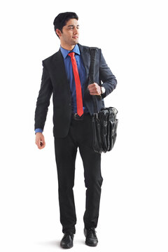 Young businessman holding briefcase