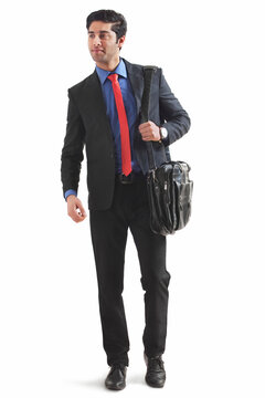 Young businessman holding briefcase