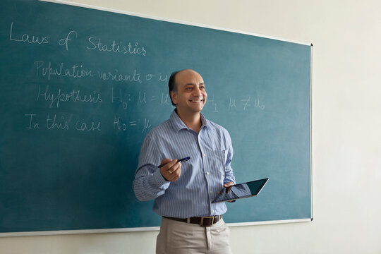 Professor holding a digital tablet while teaching