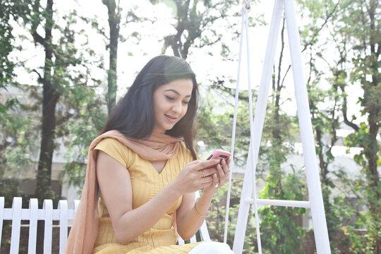 Woman reading sms on mobile phone