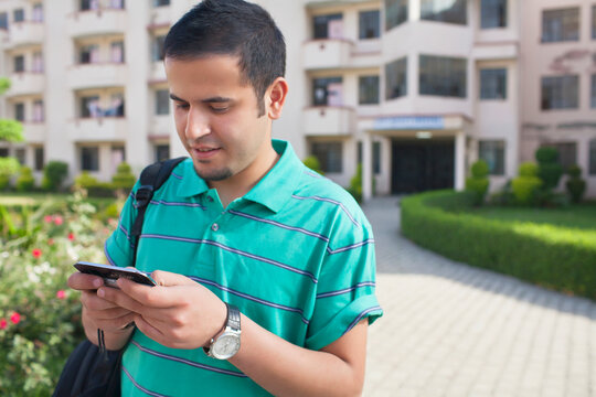 Teenager texting on mobile phone