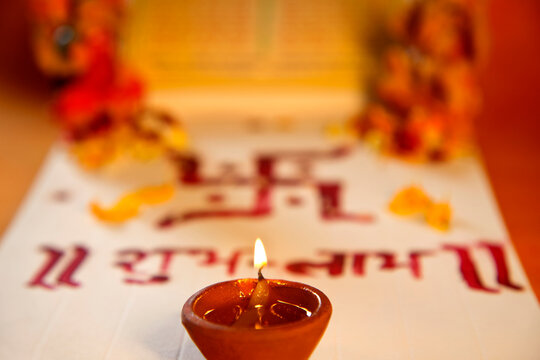 Lakshmi puja with ledger book and diya