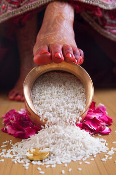 Grihapravesh of bride overturn kalash of rice on threshold