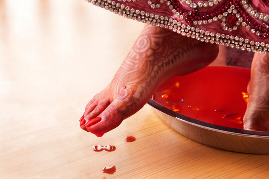 Low section view of a bride performing marriage rituals
