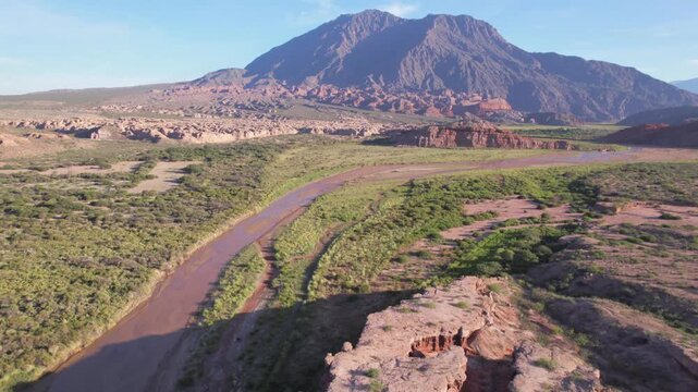 4K drone aerial view of Las Ventanas in Cafayate, Salta, Argentina. Unique red rock formations with natural openings shaped by erosion in the dramatic Quebrada de las Conchas landscape.
